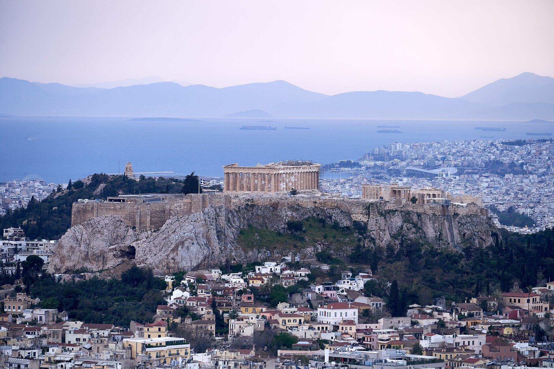 View of the Acropolis of Athens from Mt Lycabettus. In the background, the Saronic Gulf. In the distance, the Peloponnese.