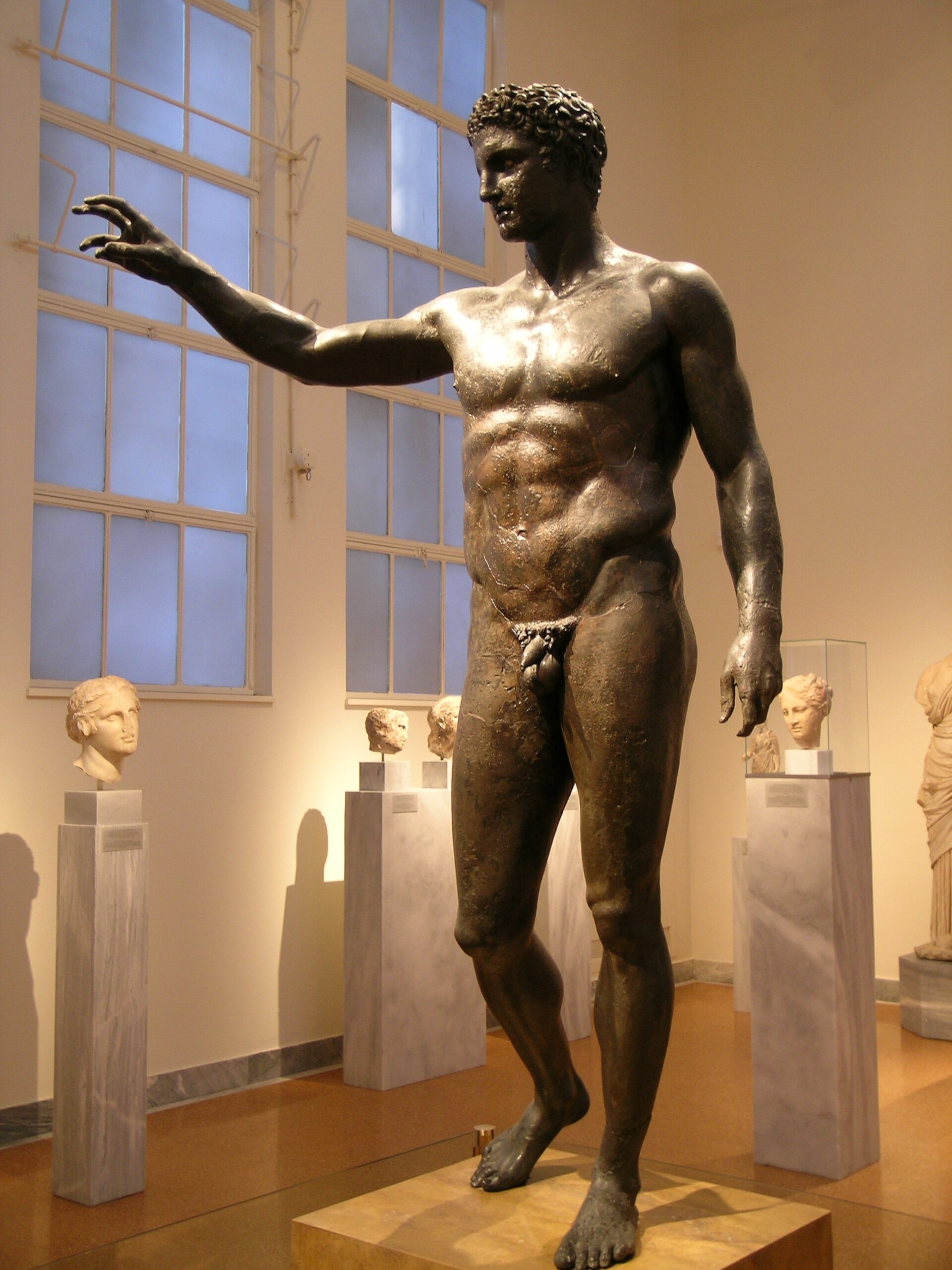 Front view of bronze statue recovered from Antikythera shipwreck in 1901, possibly depicting Paris or Heracles. Statue on display in National Archaeological Museum, Athens, Greece.