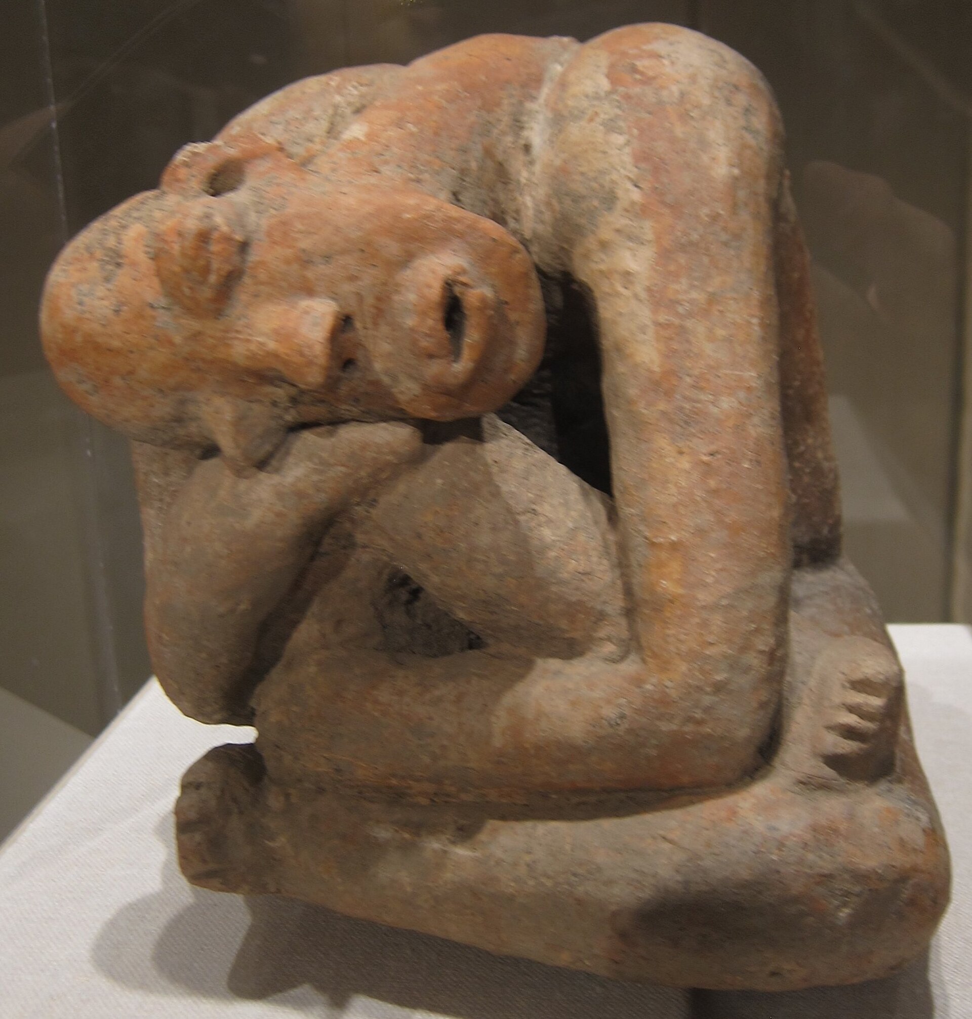 Seated figure grom Mali, Inland Niger Delta region, 13th century, Djenné peoples, Terracotta, 10 x 11 3/4in. (25.4 x 29.9cm), ceramics, Metropolitan Museum of Art, accession 1981.218