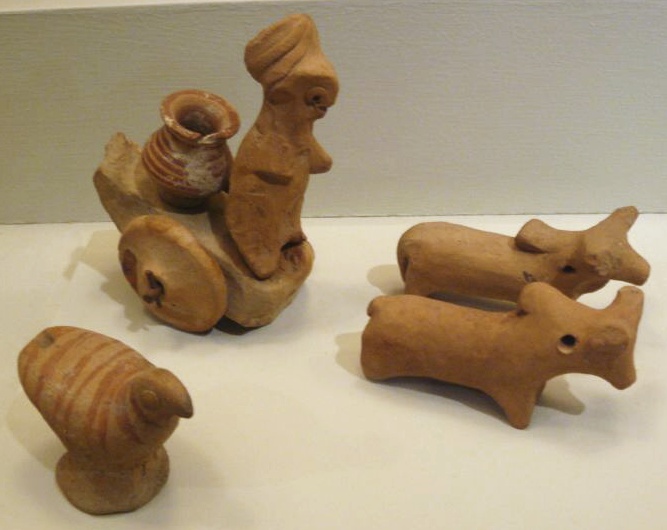 Harappa. Miniature Votive Images or Toy Models, ca. 2500. Hand-modeled terra-cotta figurines with polychromy. Brooklyn Museum, Anonymous Gift, 37.38, 37.93-.94, 37.97, 37.64.