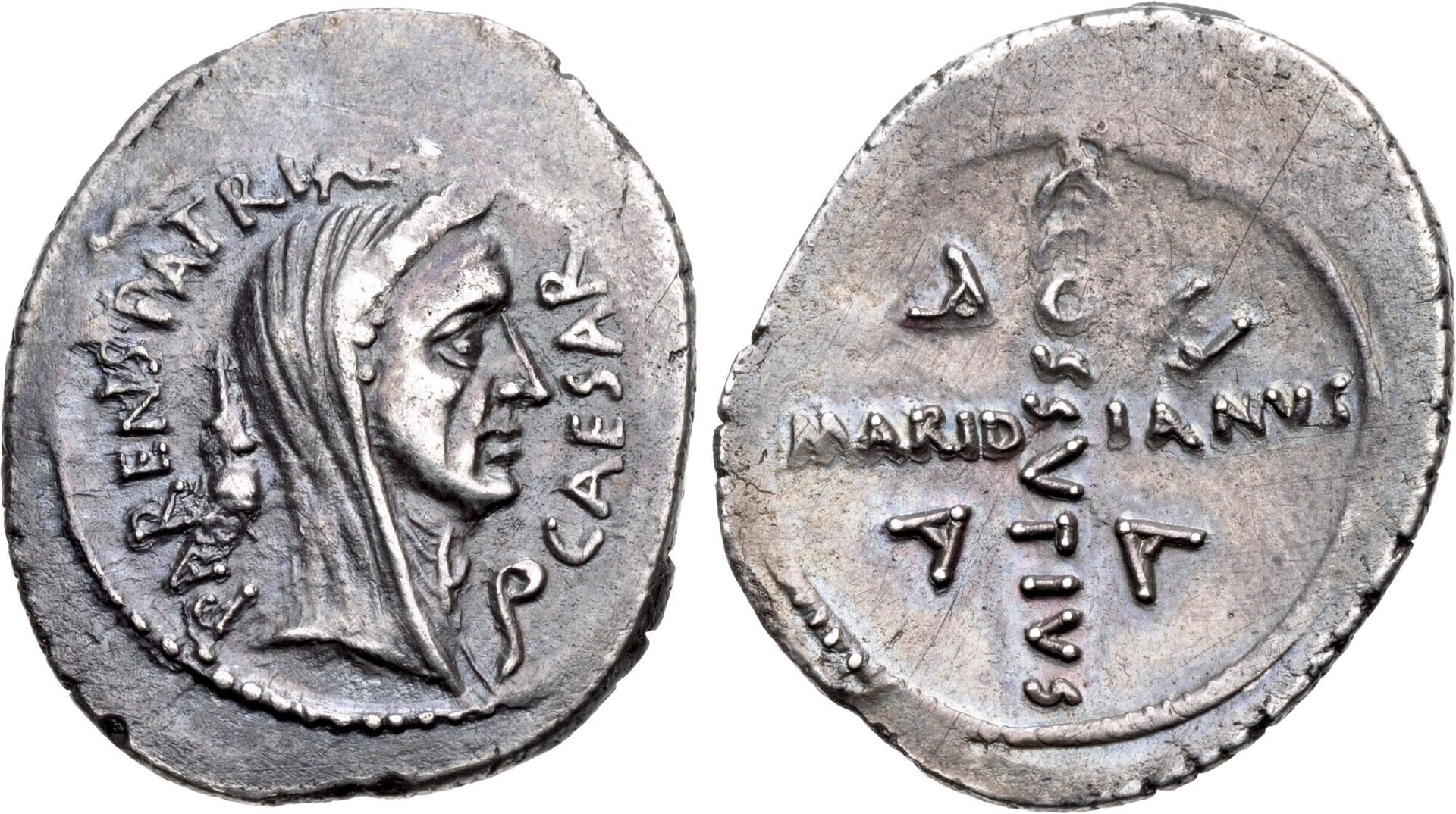 The Caesarians. Julius Caesar. April 44 BC. AR Denarius (19mm, 3.98 g, 2h). Rome mint; C. Cossutius Maridianus, moneyer. Laureate and veiled head right; apex and lituus flanking neck; PΛRENS PΛTRIΛ[E] upward to left, CΛE