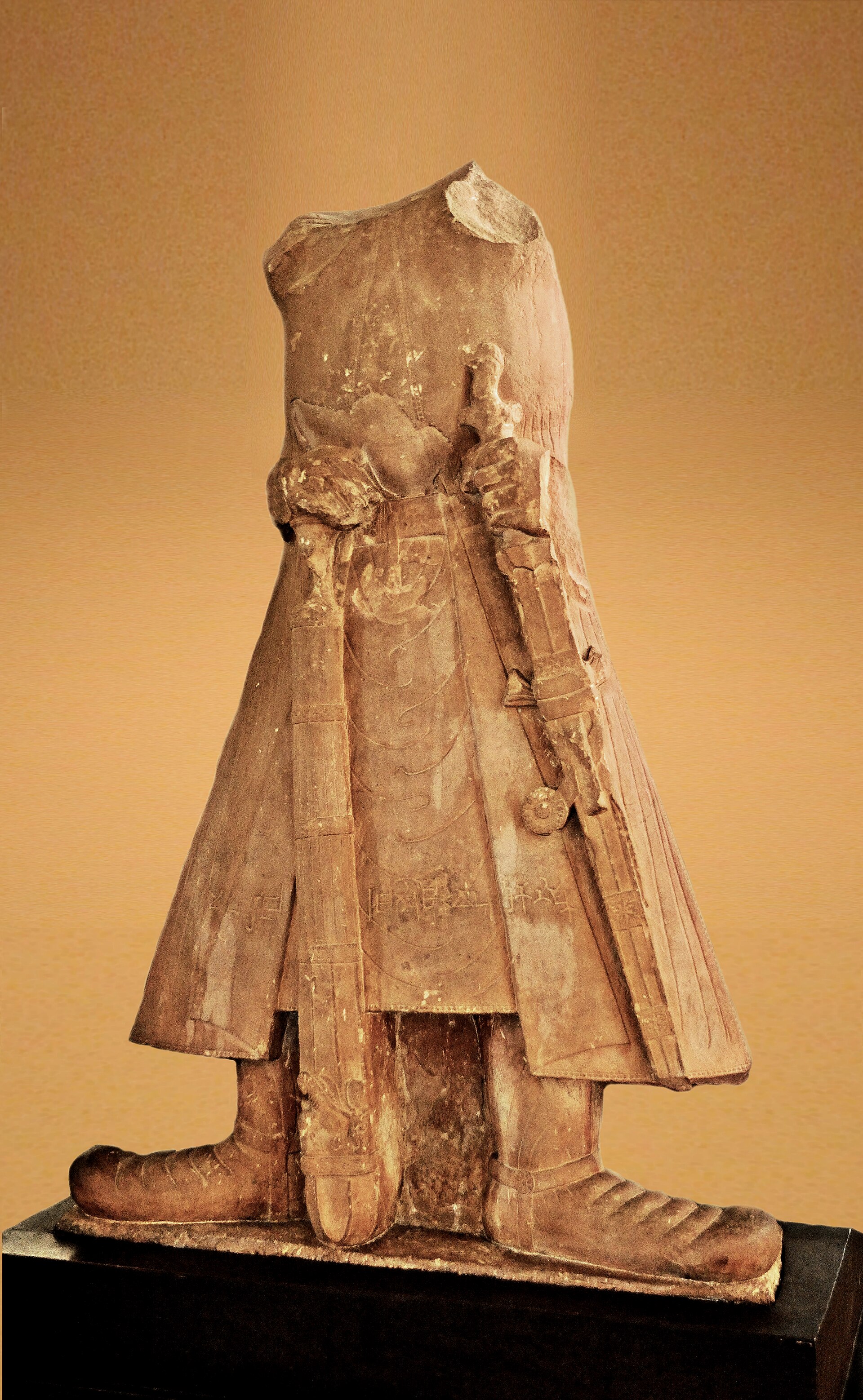 Headless statue of Kushan emperor Kanishka, 2nd century CE. Inscription in Kharosthi reads “the great King, the King of Kings, the Son of God, Kanishka.”. Sandstone. Discovered Mat near Mathura. H. 1.85 m. Government Mus