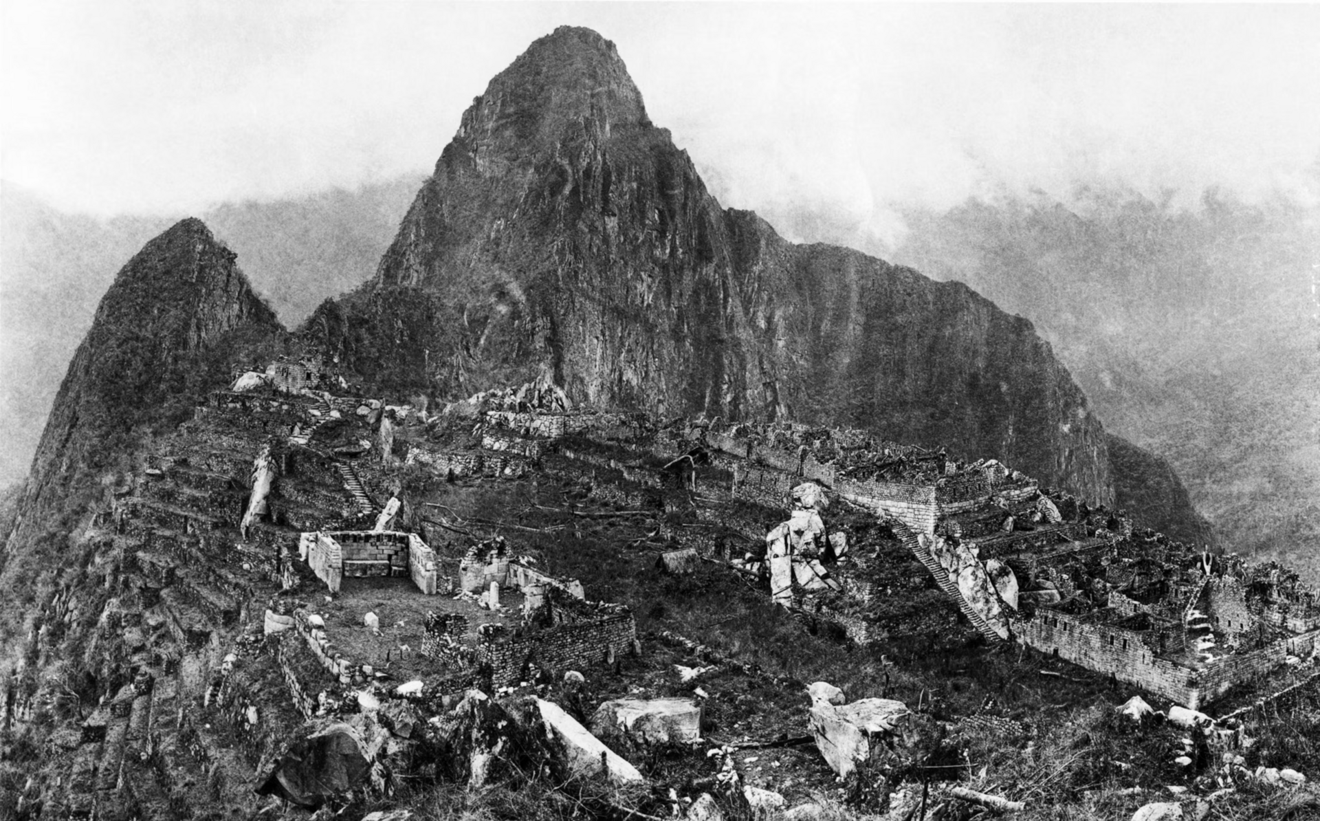 On the left are the western agricultural terraces. Above them is the Sacred Plaza, with the Chief Temple and the three-windowed temple to the right of it. Above these and connected with them by the finest stairway in Mac