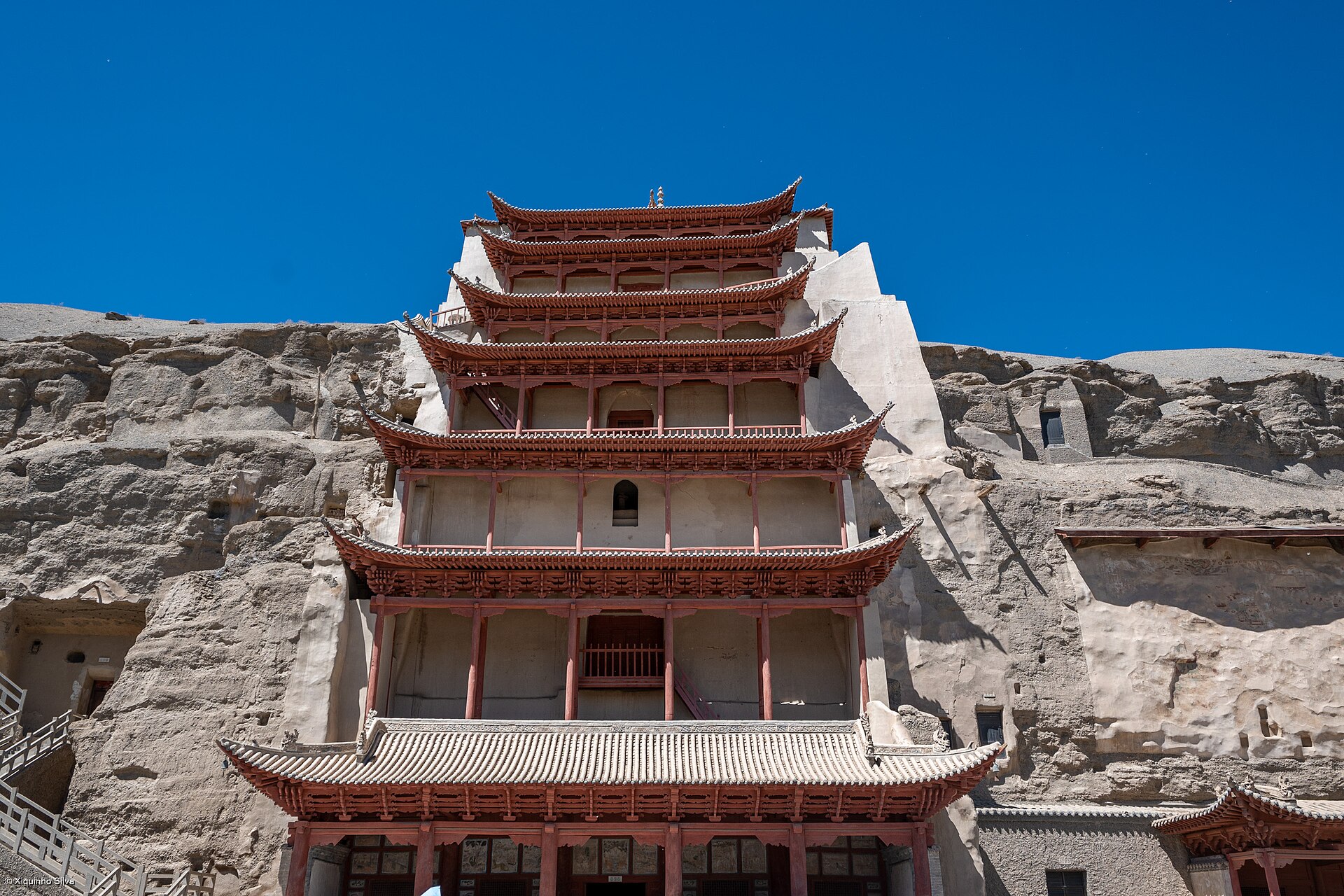 The Mogao Caves, also known as the Thousand Buddha Grottoes, are a magnificent ensemble of Buddhist art and culture located near Dunhuang, in the Gansu province of China. These caves are celebrated for their extensive co