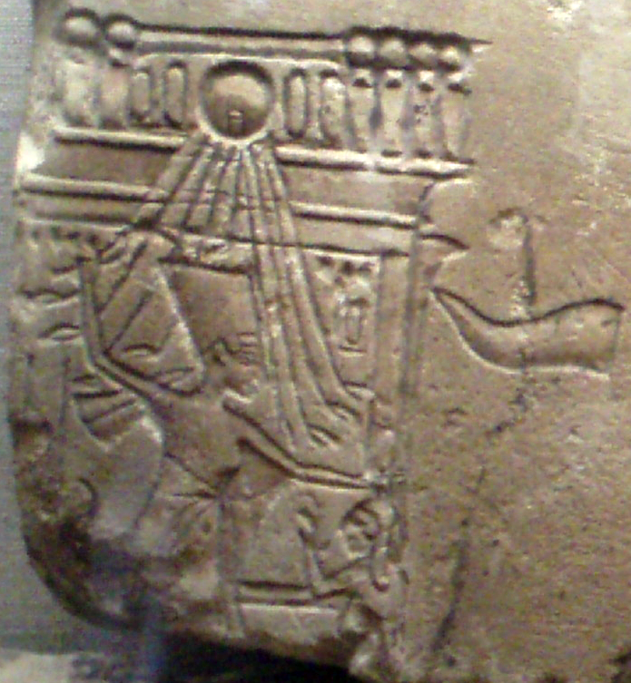 Detailed close-up of a limestone relief originally from Amarna depicting Nefertiti smiting a female captive on a royal barge. Found at Hermopolis, from the reign of Akhenaten, 1353-1336 B.C. On display at the Museum of F