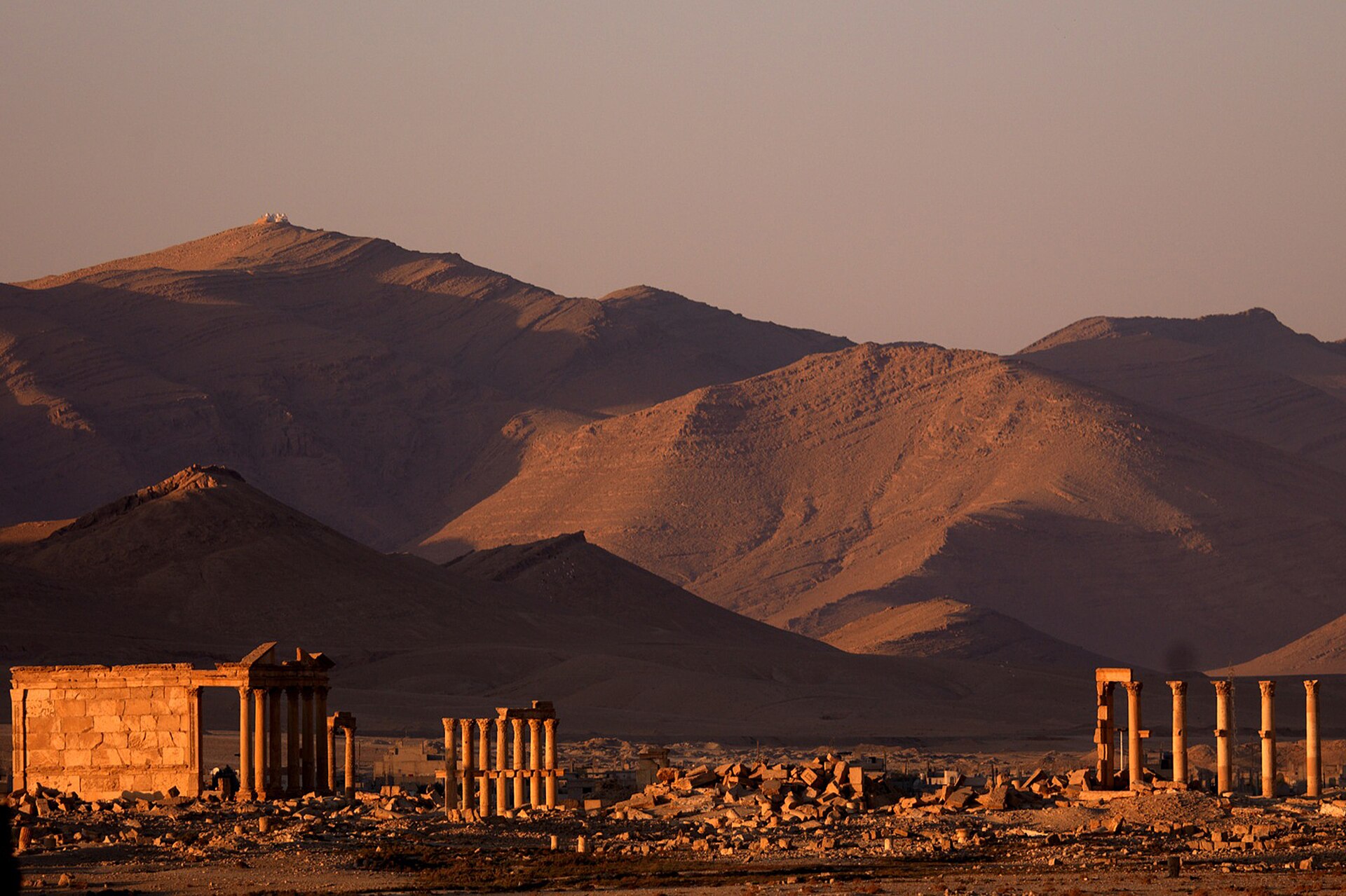Palmyra, Arabic: Tadmur, was an ancient city in central Syria. In antiquity, it was an important city located in an oasis 215 km northeast of Damascus[1] and 180 km southwest of the Euphrates at Deir ez-Zor. It had long 