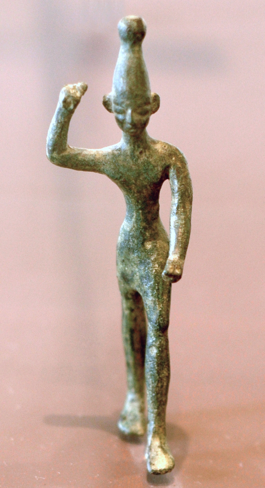 Figure of Ba'al with raised arm, 14th–12th century BC, found at ancient Ugarit (Ras Shamra site), a city at the far north of the Phoenician coast. Louvre, Paris