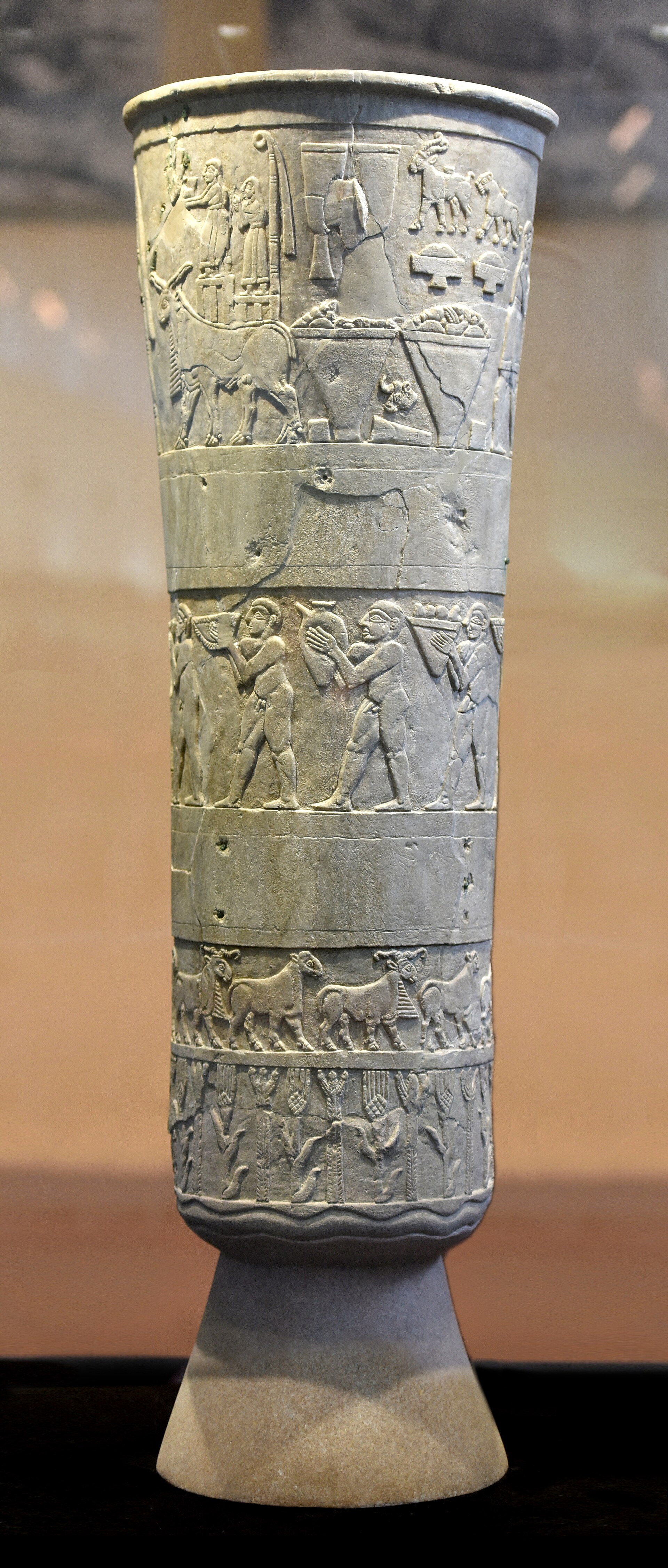 Warka vase (background retouched). The votive Vase of Warka, from Warka (ancient Uruk), Iraq. Jemdet Nasr period, 3000-2900 BCE. The Iraq Museum, Baghdad. IM19606.