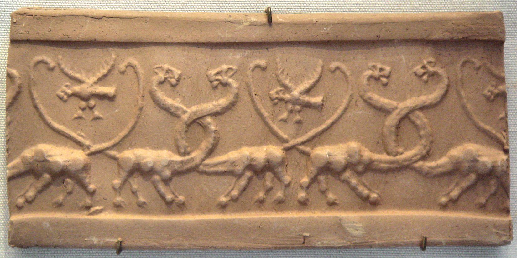 Modern clay impression of a cylinder seal with monstrous lions and lion-headed eagles, Mesopotamia, Uruk Period (4100 BC–3000 BC).